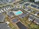 Aerial view of a community pool, clubhouse, pond, and playground in a neighborhood at 1018 Hinson Forest Rd, Monroe, NC 28110