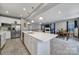 Modern open-concept kitchen with a large island, stainless steel appliances, and plenty of cabinet space at 1018 Hinson Forest Rd, Monroe, NC 28110