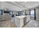 A kitchen with a large center island is open to the living and dining areas in this spacious home at 1018 Hinson Forest Rd, Monroe, NC 28110