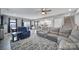Spacious living room offering a cozy seating area adjacent to the dining and kitchen areas at 1018 Hinson Forest Rd, Monroe, NC 28110