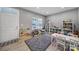 Bright playroom with organized shelving, toys, playroom furnishings, and modern, gray flooring at 1018 Hinson Forest Rd, Monroe, NC 28110