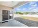 Backyard with a covered patio, sliding glass door, and well-maintained lawn at 108 Toxaway St, Mooresville, NC 28115
