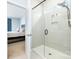 Modern glass-enclosed shower and a view of a bedroom at 108 Toxaway St, Mooresville, NC 28115