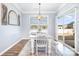 Bright dining room with large windows and sliding glass door for ample natural light at 108 Toxaway St, Mooresville, NC 28115