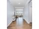 Bright foyer with hardwood floors leading to a living room filled with natural light at 108 Toxaway St, Mooresville, NC 28115