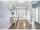 Inviting home entry with hardwood floors, bench seating and decorative wall art at 108 Toxaway St, Mooresville, NC 28115