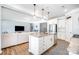 Open-concept kitchen with island seating flows into the living room, perfect for entertaining at 108 Toxaway St, Mooresville, NC 28115