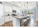 Modern kitchen featuring granite countertops, stainless steel appliances, and a breakfast bar with seating at 108 Toxaway St, Mooresville, NC 28115