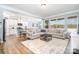 Open concept living room with lots of natural light perfect for Gathering and entertaining at 108 Toxaway St, Mooresville, NC 28115