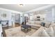 Inviting living space with an open concept, seamlessly connecting the living room and kitchen at 108 Toxaway St, Mooresville, NC 28115
