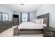 Cozy main bedroom featuring a bed, dresser, and bedside table in a relaxing atmosphere at 108 Toxaway St, Mooresville, NC 28115