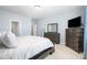 Spacious bedroom showcasing a comfortable bed, dresser, and neutral color palette at 108 Toxaway St, Mooresville, NC 28115