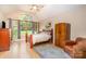 The bedroom has a large arched window with tree views, hardwood floors and an armoire at 1116 Landons Ct, China Grove, NC 28023