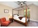 Bedroom with plush carpet, ceiling fan, four poster bed and large window at 1116 Landons Ct, China Grove, NC 28023