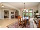 Dining room features hardwood floors, large windows, and elegant lighting at 1116 Landons Ct, China Grove, NC 28023