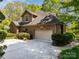 Well-maintained brick home features an attached two-car garage and mature landscaping at 1116 Landons Ct, China Grove, NC 28023