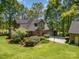Exterior view showcases the house, expansive lawn, and additional garage with ample parking at 1116 Landons Ct, China Grove, NC 28023