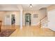 Bright foyer showcasing hardwood floors, staircase, and arched doorway at 1116 Landons Ct, China Grove, NC 28023