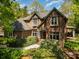 Beautiful two-story brick home featuring lush landscaping and a welcoming front entrance at 1116 Landons Ct, China Grove, NC 28023