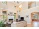 Open concept living room featuring a fireplace, high ceilings, and natural light at 1116 Landons Ct, China Grove, NC 28023