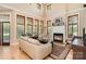 Comfortable living room with fireplace and floor to ceiling windows at 1116 Landons Ct, China Grove, NC 28023