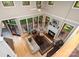 Living room with fireplace, expansive windows, and high ceilings at 1116 Landons Ct, China Grove, NC 28023