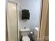 Bathroom featuring a toilet, stacked towels, and a shower at 113 Hideaway Trl, Mount Gilead, NC 27306