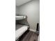 Bedroom featuring bunk beds and modern gray walls at 113 Hideaway Trl, Mount Gilead, NC 27306