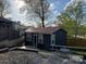 Cozy home featuring a metal roof and a charming deck for outdoor relaxation at 113 Hideaway Trl, Mount Gilead, NC 27306