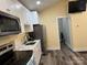 The kitchen features new stainless steel appliances, white cabinets, and modern countertops at 113 Hideaway Trl, Mount Gilead, NC 27306