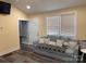 Cozy living room with sleeper sofa, natural light, and neutral paint at 113 Hideaway Trl, Mount Gilead, NC 27306