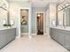 This spacious bathroom features dual vanities, marble countertops, and two separate toilet rooms at 11447 Egrets Point Dr, Charlotte, NC 28278