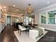Open concept view of dining area flowing into the gourmet kitchen at 11447 Egrets Point Dr, Charlotte, NC 28278