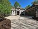 Beautiful home featuring stone accents, a large driveway, and a prominent three-car garage at 11447 Egrets Point Dr, Charlotte, NC 28278