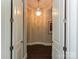 Elegant hallway with chandelier lighting and architectural detail at 11447 Egrets Point Dr, Charlotte, NC 28278