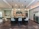 Stylish kitchen with a central island, stainless steel appliances, and modern lighting, creating a chef-friendly space at 11447 Egrets Point Dr, Charlotte, NC 28278