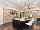 Gourmet kitchen boasts an island, granite countertops, stainless steel appliances, and pendant lighting at 11447 Egrets Point Dr, Charlotte, NC 28278