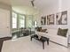 Living room with modern decor and connecting nook with bay window at 11447 Egrets Point Dr, Charlotte, NC 28278