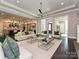 Open-concept living room flowing into a modern kitchen, perfect for entertaining and Gathering gatherings at 11447 Egrets Point Dr, Charlotte, NC 28278