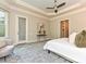 Spacious primary bedroom offers plush gray carpet, an exterior door to the back, and lots of natural light at 11447 Egrets Point Dr, Charlotte, NC 28278