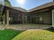 This outdoor patio has a brick base, leads to two screened porches and a grassy yard at 11447 Egrets Point Dr, Charlotte, NC 28278
