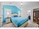 Bright bedroom featuring a vaulted ceiling, stylish lamps, and en suite bathroom access at 117 Heath Ln, Mooresville, NC 28117