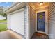 Charming home with a well-maintained attached garage and an inviting front entrance at 117 Heath Ln, Mooresville, NC 28117
