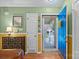 Bright foyer featuring a blue front door, wooden floors, and decorative accents at 117 Heath Ln, Mooresville, NC 28117