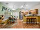 Open concept kitchen and dining area with stainless steel appliances and ample cabinet space at 117 Heath Ln, Mooresville, NC 28117
