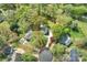 Aerial view of the property outlining the lot lines, showcasing the house and surrounding landscape at 11700 Fernhurst Ln, Charlotte, NC 28277