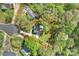 Aerial view of the property within lot lines, showcasing its position at the end of a cul-de-sac in a leafy neighborhood at 11700 Fernhurst Ln, Charlotte, NC 28277