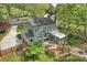 Aerial view of the home showcasing the patio, sunroom, landscaped yard, and fenced backyard at 11700 Fernhurst Ln, Charlotte, NC 28277