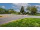 View of clubhouse amenities including parking area and landscaped entryway at 11700 Fernhurst Ln, Charlotte, NC 28277