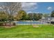 Community pool with fenced perimeter and ample space to lounge in the sun at 11700 Fernhurst Ln, Charlotte, NC 28277